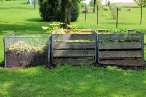 three composting bins with different levels of compost