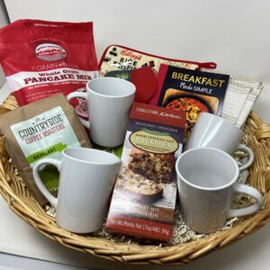 photo of gift basket with assorted breakfast good and two mugs