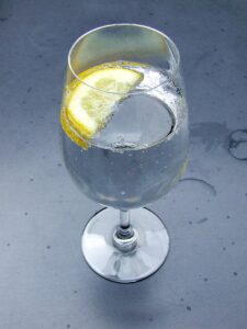 glass of sparkling water with lemon wedge