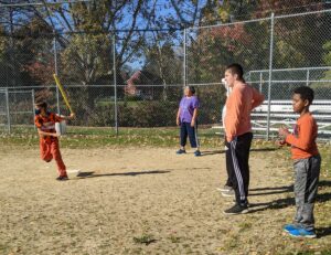 kids playing whiffle ball