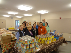 A group of people helping out at the food pantry