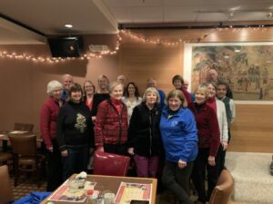 Group of food pantry volunteers gathered together at a restaurant