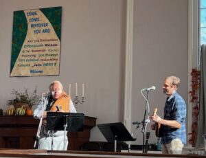 Kim and Geoffrey Goodhue performing on autoharp and mandolin