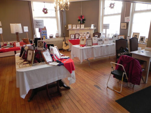 Photo of goods set up on tables for sale at the Red Bow Fair