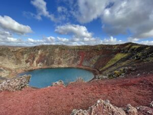 Photo that Rev. Lee took in Iceland of bright blue water at the bottom of a crater