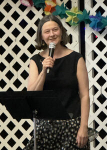 Photo of Rev. Lee speaking at her 25 year anniversary party