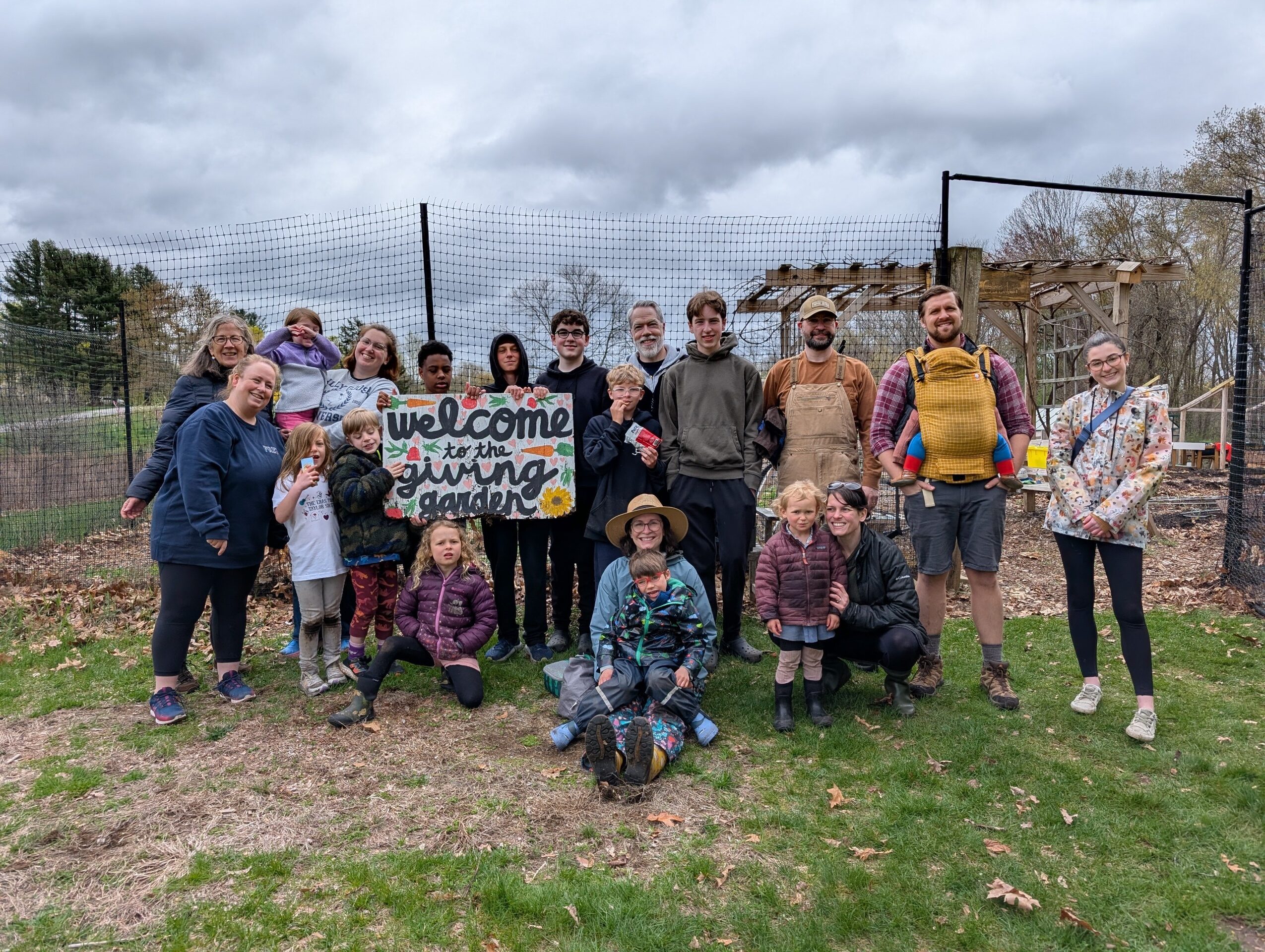 Photo of RE youth and the community action team gathered at the Giving Garden