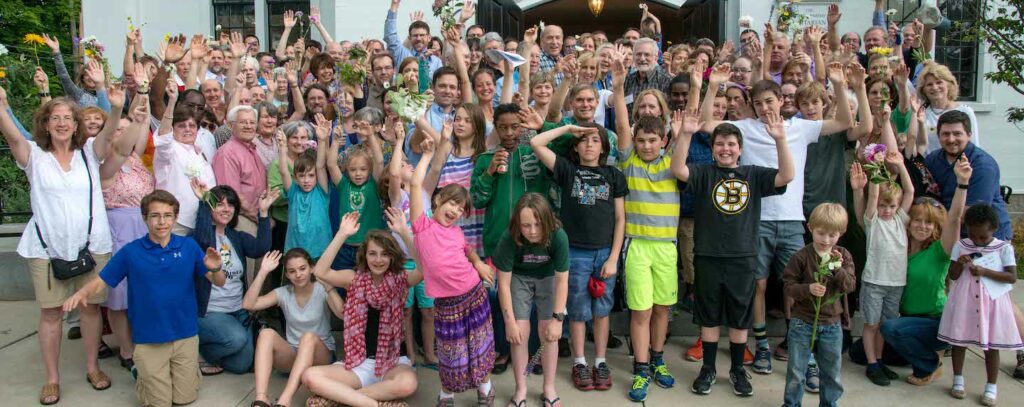 Members and friends standing in front of the church after Flower Communion