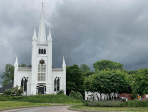 North Parish as seen across the roundabout, set against stormy skies