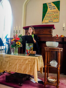 Rev. Lee at the altar