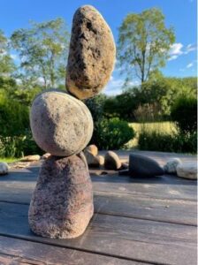 three rocks stacked and balanced on one another