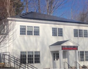 Solar panels atop the offices wing on Great Pond Road